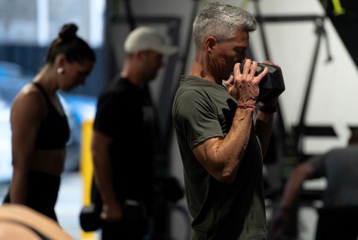 Members training together with dumbbells
