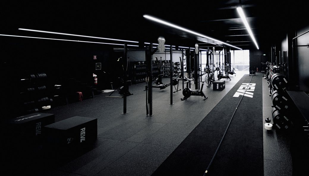 Inside REVL: the training floor, the sled track and the light from the street