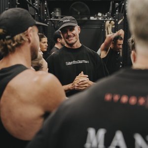 A REVL coach talking with members after a session